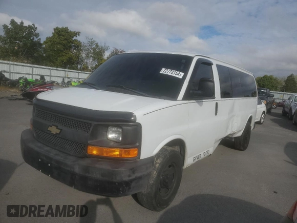 2014 Chevrolet Express Passenger 1LS with VIN 1GAZGZFAXE1105162, listed as a Copart auction lot 72773154 with 97,950 mi miles and Salvage title. Bid and sale history available at DreamBid. Image 1.