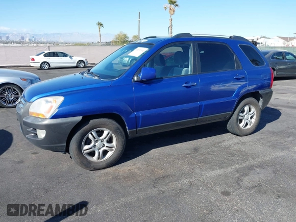 2005 Kia Sportage LX with VIN KNDJF723457057402, listed as a IAAI auction lot 41471742 with 215,565 mi miles and . Bid and sale history available at carsss.com. Image 2.
