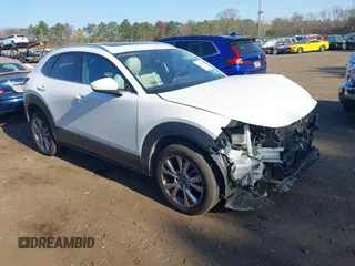 2021 Mazda CX-30 Premium with VIN 3MVDMBDM0MM237278, listed as a IAAI auction lot 42050766 with 63,813 mi miles and . Bid and sale history available at DreamBid. Image 1.