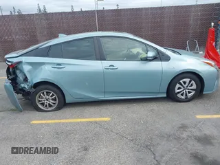 2016 Toyota Prius Four z VIN JTDKARFU8G3018145, wystawiony jako IAAI lot #42195308 z przebiegiem 87 649 mil mil oraz . Historia ofert i sprzedaży dostępna na DreamBid. Obrazek 13.