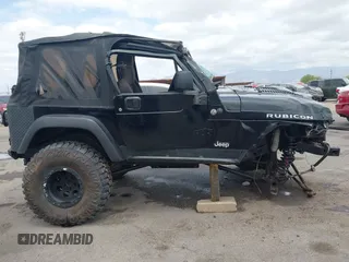 2004 Jeep Wrangler Rubicon z VIN 1J4FA69S84P727716, wystawiony jako IAAI lot #42162129 z przebiegiem 90 844 mil mil oraz . Historia ofert i sprzedaży dostępna na DreamBid. Obrazek 14.