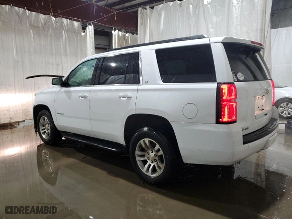 2019 Chevrolet Tahoe LT with VIN 1GNSKBKC3KR307481, listed as a Copart auction lot 82666844 with 106,309 mi miles and Salvage Title. Bid and sale history available at carsss.com. Image 2.