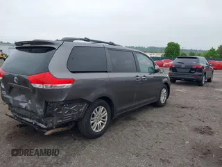 2014 Toyota Sienna XLE with VIN 5TDYK3DC0ES436502, listed as a IAAI auction lot 42180990 with 154,839 mi miles and . Bid and sale history available at DreamBid. Image 4.