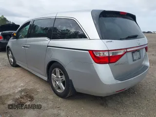 2012 Honda Odyssey Touring with VIN 5FNRL5H98CB026754, listed as a IAAI auction lot 41935562 with 165,626 mi miles. Bid and sale history available at carsss.com. Image 3.