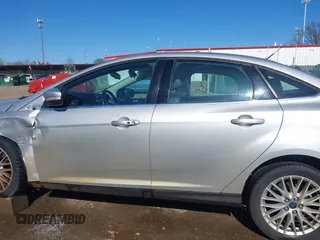 2014 Ford Focus Titanium with VIN 1FADP3J28EL354505, listed as a IAAI auction lot 42025966 with 104,868 mi miles. Bid and sale history available at carsss.com. Image 15.