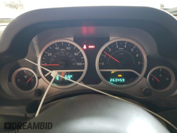 2007 Jeep Wrangler Rubicon z VIN 1J8GA64117L187431, wystawiony jako Copart lot #61293624 z przebiegiem 263 459 mil mil oraz Szkoda całkowita • Salvage title. Historia ofert i sprzedaży dostępna na DreamBid. Obrazek 9.
