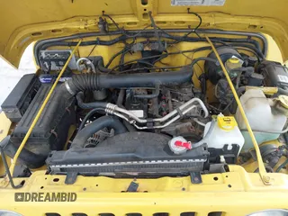 2002 Jeep Wrangler X z VIN 1J4FA39S82P719241, wystawiony jako IAAI lot #42150742 z przebiegiem 147 914 mil mil oraz . Historia ofert i sprzedaży dostępna na DreamBid. Obrazek 10.