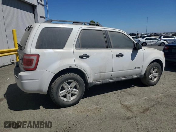 2011 Ford Escape Hybrid z VIN 1FMCU5K39BKA88197, wystawiony jako Copart lot #50896195 z przebiegiem 186 007 mil mil oraz Czysty tytuł • Clean title. Historia ofert i sprzedaży dostępna na DreamBid. Obrazek 3.