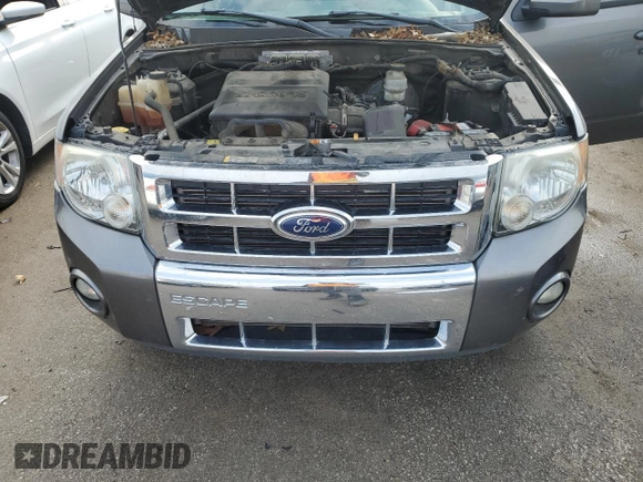 2012 Ford Escape Limited z VIN 1FMCU0EG1CKB30638, wystawiony jako Copart lot #52905205 z przebiegiem 169 683 mil mil oraz Szkoda całkowita • Salvage title. Historia ofert i sprzedaży dostępna na DreamBid. Obrazek 14.
