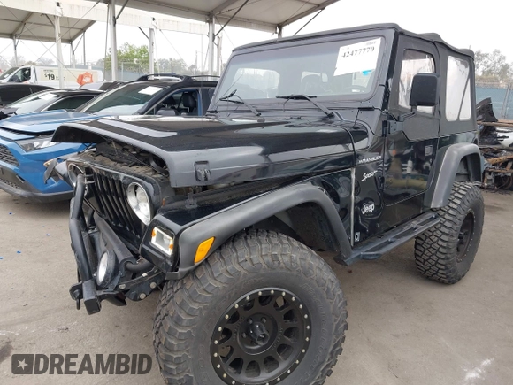2002 Jeep Wrangler Sport with VIN 1J4FA49S02P705470, listed as a IAAI auction lot 42477770 with 59,395 mi miles and . Bid and sale history available at DreamBid. Image 2.
