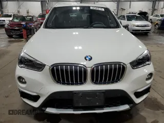 2017 BMW X1 xDrive28i with VIN WBXHT3Z38H4A53824, listed as a Copart auction lot 52500215 with 106,782 mi miles and Salvage title. Bid and sale history available at DreamBid. Image 5.