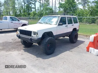1996 Jeep Cherokee Country with VIN 1J4FJ78SXTL189940, listed as a IAAI auction lot 42020459 with 181,035 mi miles. Bid and sale history available at carsss.com. Image 2.