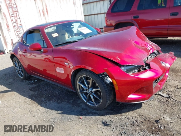 2020 Mazda MX-5 Miata Grand Touring z VIN JM1NDAM77L0418499, wystawiony jako IAAI lot #42010802 z przebiegiem 19 588 mil mil oraz . Historia ofert i sprzedaży dostępna na DreamBid. Obrazek 1.