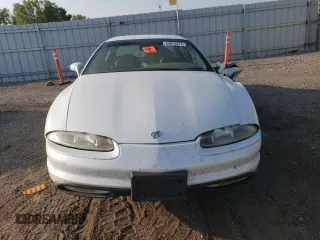1997 Oldsmobile Aurora z VIN 1G3GR62CXV4124968, wystawiony jako Copart lot #69615474 z przebiegiem 249 895 mil mil oraz Nie do naprawy. Historia ofert i sprzedaży dostępna na DreamBid. Obrazek 5.