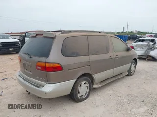 1999 Toyota Sienna LE with VIN 4T3ZF13C5XU164075, listed as a IAAI auction lot 42063741 with 93,407 mi miles. Bid and sale history available at carsss.com. Image 4.