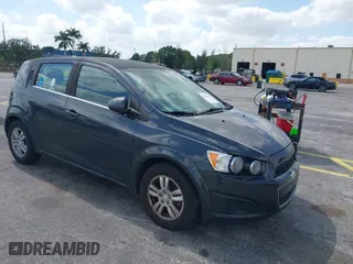 2014 Chevrolet Sonic LT with VIN 1G1JC6SB2E4115463, listed as a IAAI auction lot 42106600 with 135,652 mi miles. Bid and sale history available at carsss.com. Image 1.