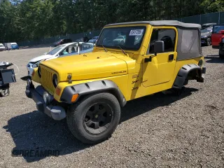 2000 Jeep Wrangler Sport with VIN 1J4FA49S0YP766956, listed as a Copart auction lot 65417295 with 158,372 mi miles and Salvage title. Bid and sale history available at DreamBid. Image 1.
