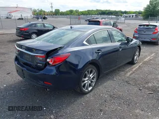 2015 Mazda 6 i Grand Touring with VIN JM1GJ1W53F1200121, listed as a IAAI auction lot 42173036 with 76,184 mi miles and . Bid and sale history available at DreamBid. Image 4.