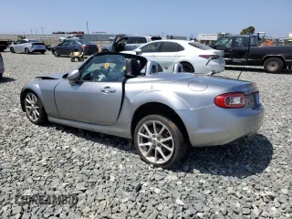 2010 Mazda MX-5 Miata Grand Touring with VIN JM1NC2FF5A0205190, listed as a Copart auction lot 61372455 with 147,852 mi miles and Salvage title. Bid and sale history available at DreamBid. Image 2.