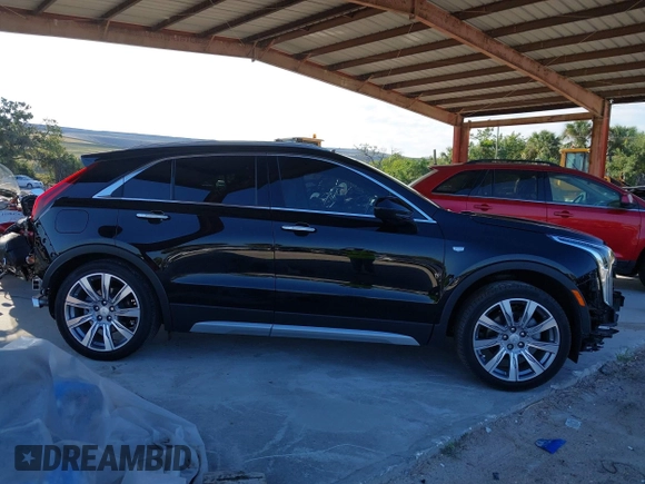 2020 Cadillac XT4 FWD Premium Luxury with VIN 1GYFZCR42LF144359, listed as a IAAI auction lot 42012677 with 34,490 mi miles and . Bid and sale history available at carsss.com. Image 14.