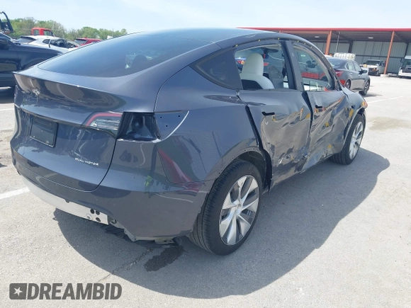2023 Tesla Model Y Long Range z VIN 7SAYGDEE1PA158661, wystawiony jako IAAI lot #41983897 z przebiegiem 20 176 mil mil oraz . Historia ofert i sprzedaży dostępna na DreamBid. Obrazek 4.