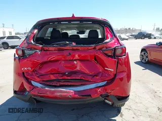 2021 Mazda CX-5 Grand Touring with VIN JM3KFADM5M0470483, listed as a IAAI auction lot 42785031 with 30,749 mi miles and . Bid and sale history available at DreamBid. Image 16.