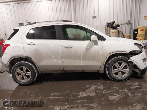 2015 Chevrolet Trax LT with VIN 3GNCJRSB7FL203418, listed as a IAAI auction lot 41572289 with 148,402 mi miles and . Bid and sale history available at DreamBid. Image 13.