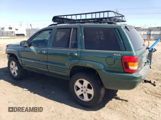 1999 Jeep Grand Cherokee Limited with VIN 1J4GW68SXXC581130, listed as a Copart auction lot 43532245 with 265,886 mi miles and Salvage Title. Bid and sale history available at carsss.com. Image 2.