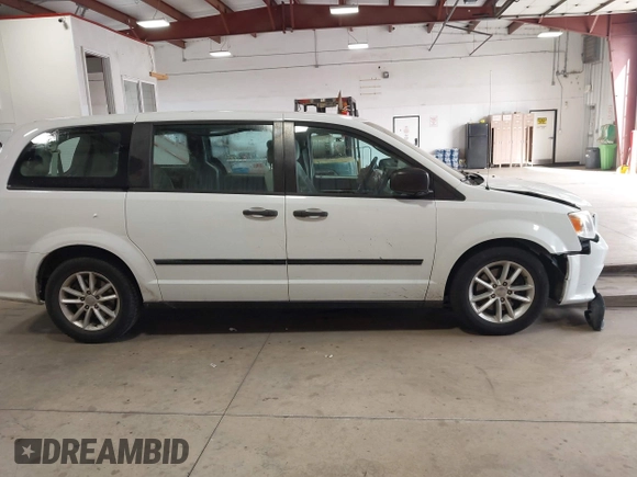 2014 Dodge Grand Caravan American Value with VIN 2C4RDGBG7ER345277, listed as a IAAI auction lot 42061355 with 145,889 mi miles and . Bid and sale history available at DreamBid. Image 13.