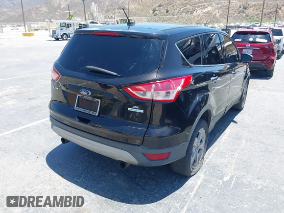 2013 Ford Escape SE z VIN 1FMCU0GX5DUA13261, wystawiony jako IAAI lot #42548111 z przebiegiem 183 037 mil mil oraz . Historia ofert i sprzedaży dostępna na DreamBid. Obrazek 4.