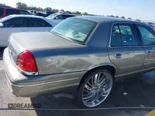 2002 Ford Crown Victoria Police Police Interceptor with VIN 2FAFP71W52X143053, listed as a IAAI auction lot 41594827 with 210,078 mi miles. Bid and sale history available at carsss.com. Image 6.