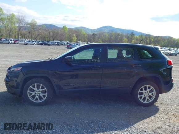 2014 Jeep Cherokee Sport with VIN 1C4PJLAB4EW110051, listed as a IAAI auction lot 41961698 with 153,570 mi miles and . Bid and sale history available at DreamBid. Image 14.