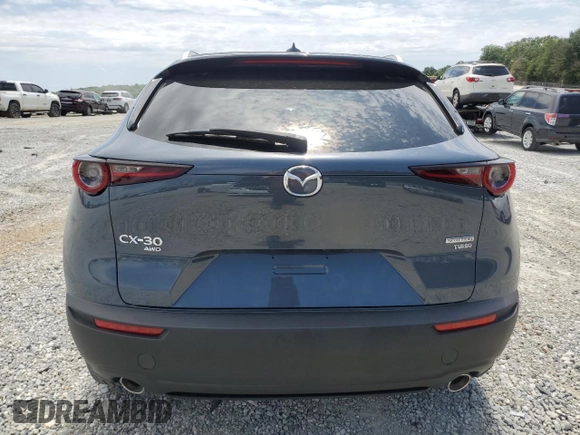 2023 Mazda CX-30 Premium with VIN 3MVDMBDY1PM509621, listed as a Copart auction lot 58316715 with 27,979 mi miles and Salvage title. Bid and sale history available at DreamBid. Image 6.