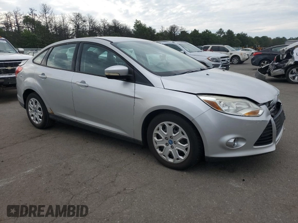 2012 Ford Focus SE with VIN 1FAHP3F2XCL202510, listed as a Copart auction lot 64066545 with 77,828 mi miles and Salvage title. Bid and sale history available at DreamBid. Image 4.