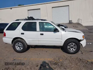 2002 Isuzu Rodeo S with VIN 4S2CK58W524321108, listed as a IAAI auction lot 42352330 with 270,614 mi miles and . Bid and sale history available at DreamBid. Image 14.