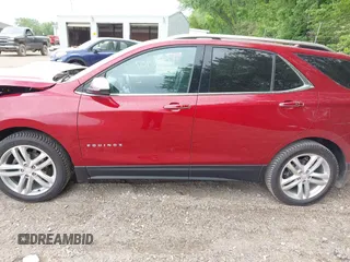 2018 Chevrolet Equinox Premier z VIN 2GNAXMEV3J6329268, wystawiony jako IAAI lot #42240907 z przebiegiem 61 487 mil mil oraz . Historia ofert i sprzedaży dostępna na DreamBid. Obrazek 14.