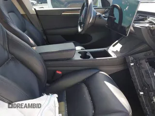 2023 Tesla Model Y Long Range with VIN 7SAYGAEE1PF665934, listed as a IAAI auction lot 41780949 with 21,949 mi miles and . Bid and sale history available at DreamBid. Image 5.