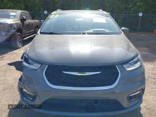 2022 Chrysler Pacifica Touring L with VIN 2C4RC1BG3NR168565, listed as a IAAI auction lot 42150290 with 61,750 mi miles and . Bid and sale history available at DreamBid. Image 12.