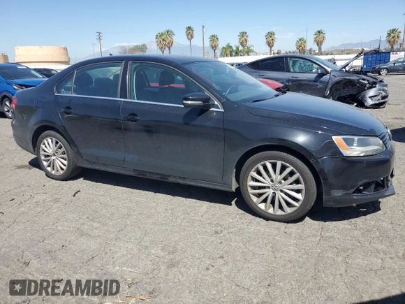 2012 Volkswagen Jetta SEL with VIN 3VWLP7AJ0CM327814, listed as a Copart auction lot 52235685 with 97,705 mi miles and Salvage title. Bid and sale history available at DreamBid. Image 4.