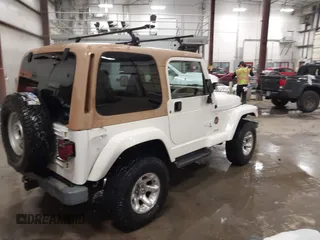 1997 Jeep Wrangler Sahara with VIN 1J4FY49S3VP529837, listed as a IAAI auction lot 41752978 with 138,024 mi miles. Bid and sale history available at carsss.com. Image 4.