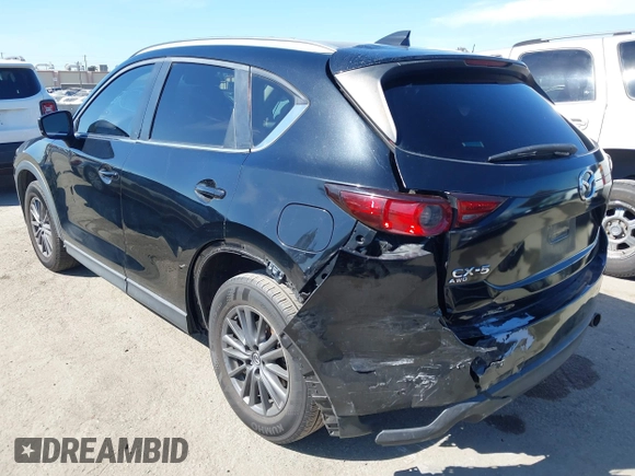 2019 Mazda CX-5 Sport with VIN JM3KFABM7K1579747, listed as a IAAI auction lot 41965097 with 151,042 mi miles and . Bid and sale history available at DreamBid. Image 3.
