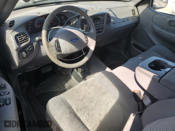 2003 Ford F-150 XL with VIN 1FTRX18L63NA76059, listed as a Copart auction lot 60846555 with 57,346 mi miles and Salvage title. Bid and sale history available at DreamBid. Image 8.
