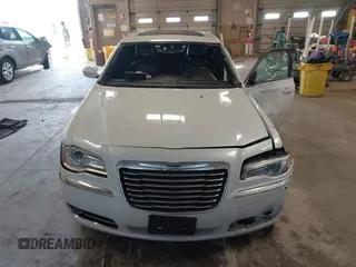 2014 Chrysler 300 with VIN 2C3CCAAGXEH217715, listed as a IAAI auction lot 41666179 with 145,744 mi miles and . Bid and sale history available at DreamBid. Image 12.