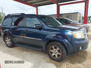 2011 Honda Pilot Touring z VIN 5FNYF3H94BB032105, wystawiony jako IAAI lot #42435522 z przebiegiem 247 899 mil mil oraz . Historia ofert i sprzedaży dostępna na DreamBid. Obrazek 13.
