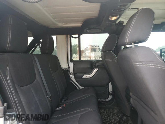 2013 Jeep Wrangler Unlimited Rubicon with VIN 1C4BJWFG5DL661282, listed as a Copart auction lot 57471035 with 128,400 mi miles and Salvage title. Bid and sale history available at DreamBid. Image 11.
