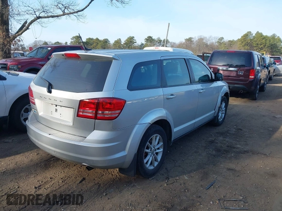 2014 Dodge Journey SE with VIN 3C4PDCAB1ET247218, listed as a IAAI auction lot 41760408 with 148,591 mi miles and . Bid and sale history available at carsss.com. Image 4.