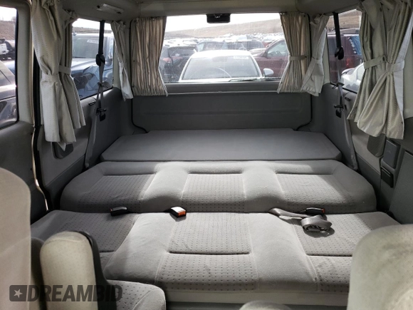 2002 Volkswagen EuroVan MV с VIN WV2NB47052H015757, выставлен на аукционе Copart как лот 81666434 с пробегом 191 543 миль миль и Чистый • Clean title. История ставок и продаж доступна на DreamBid. Изображение 10.