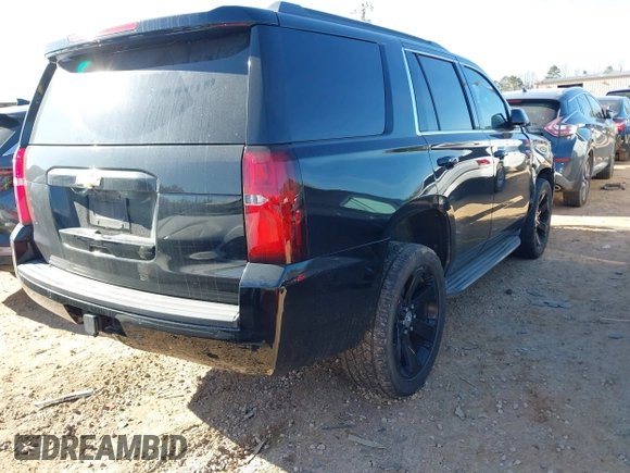 2015 Chevrolet Tahoe LT with VIN 1GNSCBKC5FR156050, listed as a IAAI auction lot 41486815 with 220,599 mi miles and . Bid and sale history available at DreamBid. Image 4.