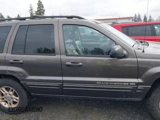 1999 Jeep Grand Cherokee Limited with VIN 1J4GW68N7XC739479, listed as a IAAI auction lot 41448323 with 129,840 mi miles. Bid and sale history available at carsss.com. Image 13.