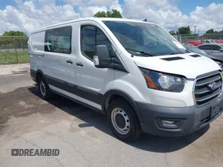 2020 Ford Transit Cargo z VIN 1FTYE1Y86LKA49989, wystawiony jako IAAI lot #42500585 z przebiegiem 172 364 mil mil oraz . Historia ofert i sprzedaży dostępna na DreamBid. Obrazek 1.